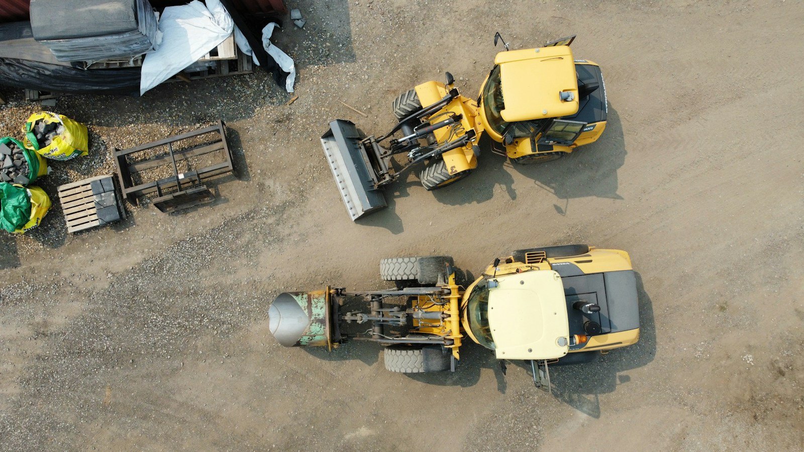 Heavy equipment parked in an industrial yard