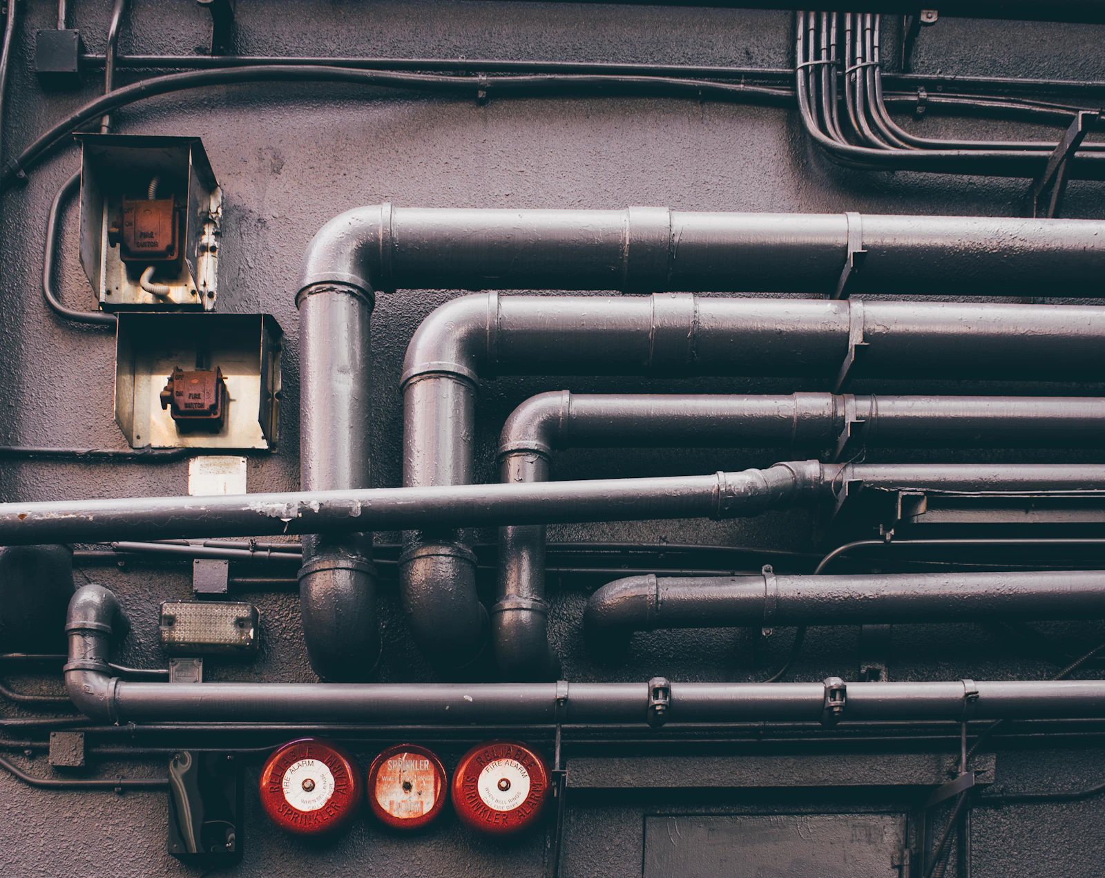 Industrial pipes and valves – industry reference Exposed industrial pipes and valves on a processing facility