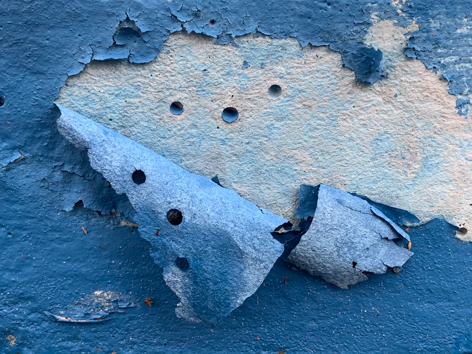 Peeling paint and coatings – reference Close view of a peeling blue coating