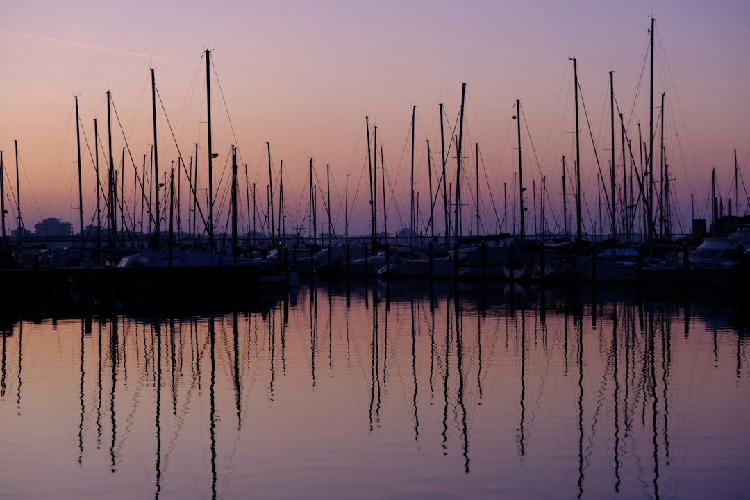 Sailboats and marine equipment reference Sailboats moored in a marina