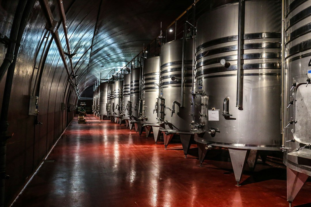 Winery equipment with stainless steel tanks and piping